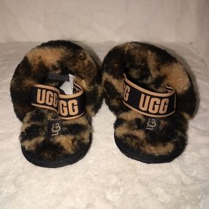 Toddler open toed Ugg slippers. Brand new. Size 7c but runs small.